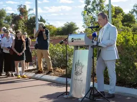 Mayor Mark Irwin speaks at a lecturn