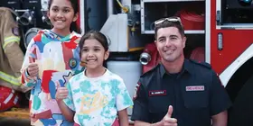 a man and two girls posing for a picture