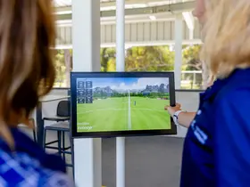 The screen at the driving range bay