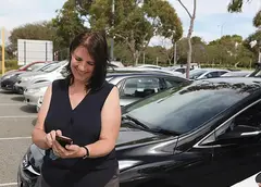 A woman using the EasyPark app