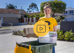 A yellow-lid recycling bin and a woman in an R t-shirt