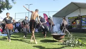 A traditional dance near a fire