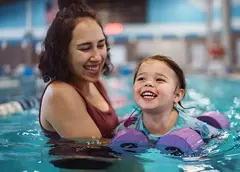 A mother and child swimming