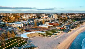 a city with buildings and sand
