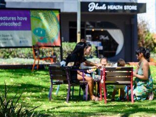 Image of community members having a picnic at Ingelwood Community Hub