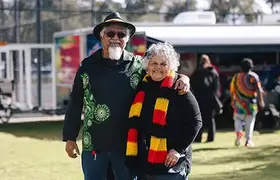 Two Aboriginal people smiling