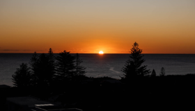 An ocean view at sunset