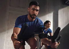 People on exercise bikes