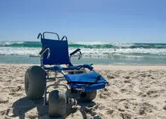 A beach wheelchair near the ocean