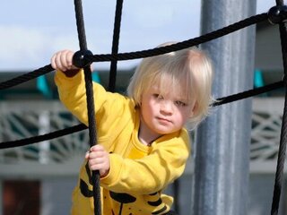 Image of child playing on climbing frame at Robinson Reserve