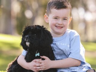 Image of child and their dog in Stirling Civic Gardens