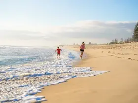 Children running on the beach