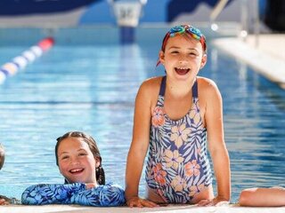 a group of kids in a pool