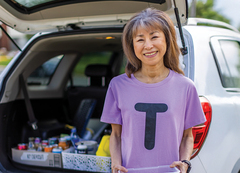 A woman in a T t-shirt