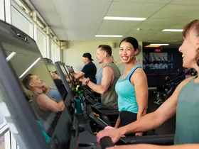 A group of women using the treadmills